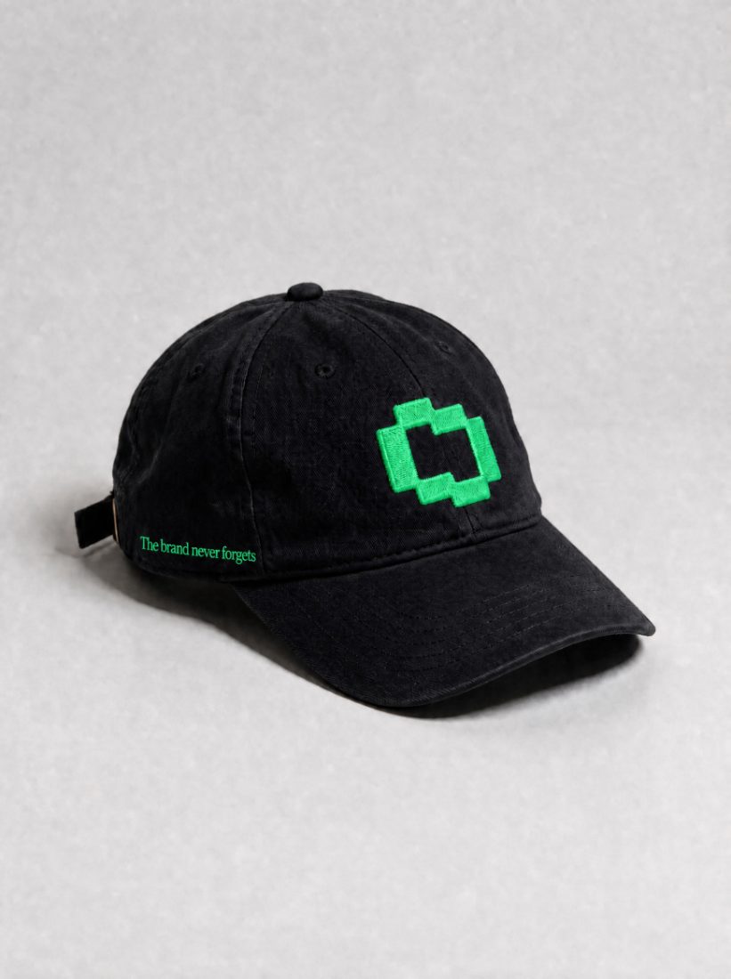 Black cap, green TBMC icon, side hit