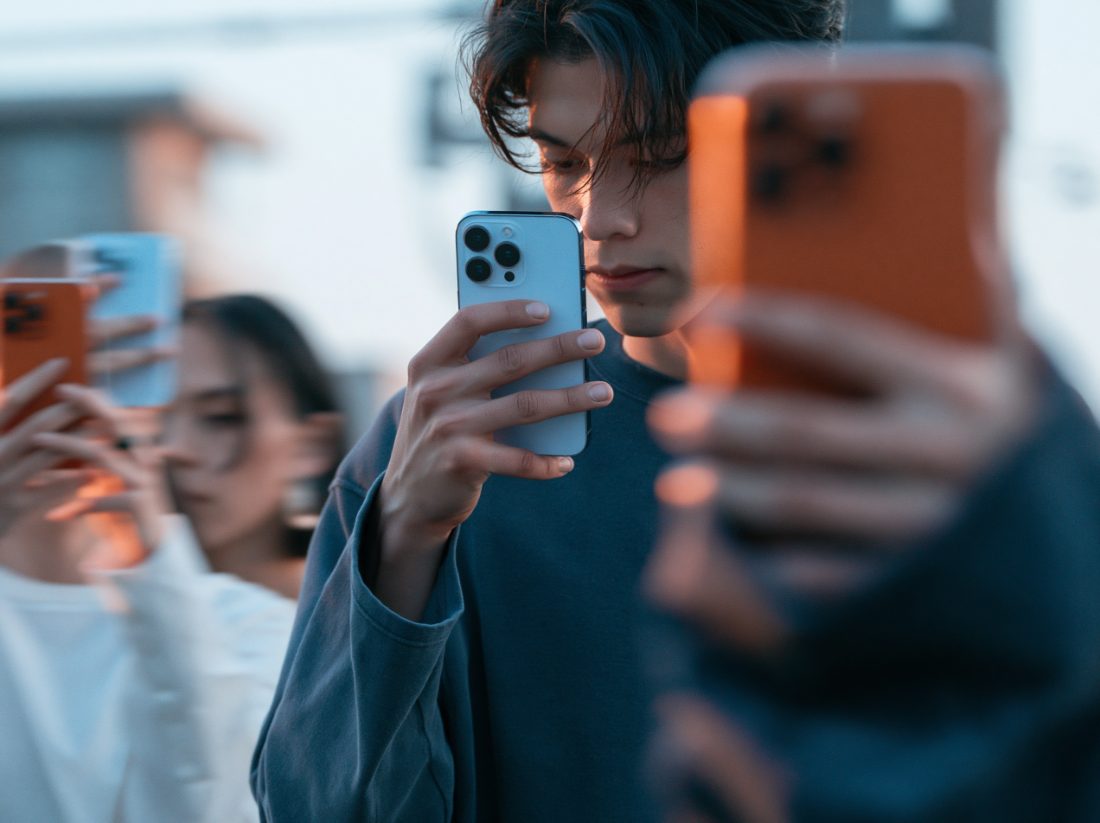 Device in hand, ghosted